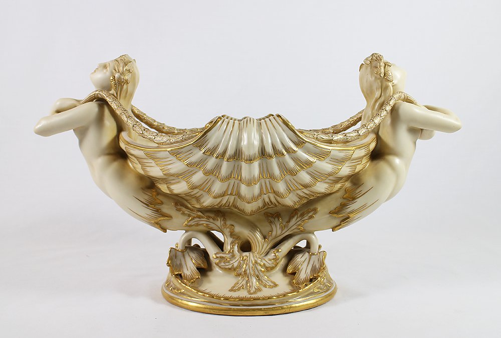 19TH CENTURY MINTON NYMPH CENTERPIECE BOWL: Large Mintons shell centerpiece bowl with nude handles and gold trim. 16" x 9.5", Mintons red mark on base and also embossed Mintons 1182 with a crown.