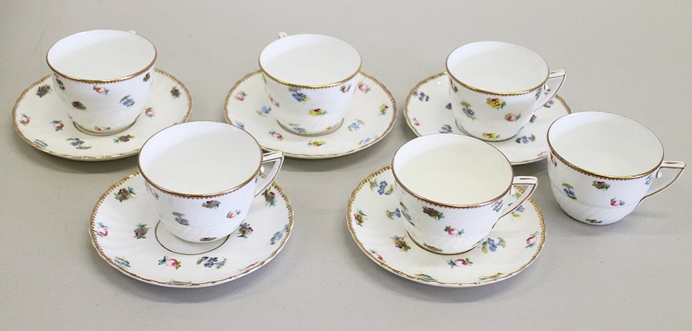 TEACUPS & SAUCERS SET: Derby (?) 6 Teacups & 5 saucers with red crossed sword mark.