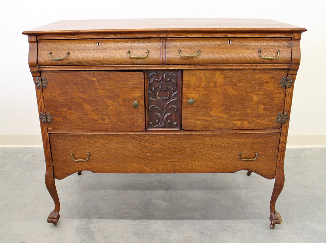 OAK CABINET: Antique oak cabinet with two cabinet doors & three drawers. 39" tall 46" x 22" wide.