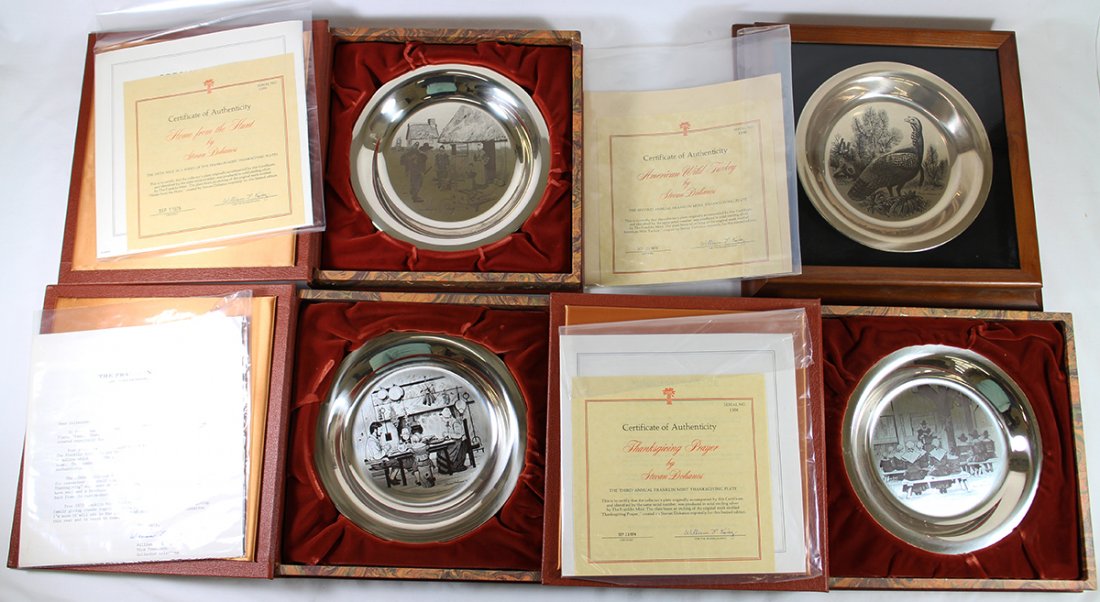 (4) STERLING FRANKLIN MINT STEVAN DOHANOS PLATES: Four Franklin Mint sterling silver Stevan Dohanos plates including American Wild Turkey, Thanksgiving Prayer, Family Thanksgiving, and Home From the Hunt. Three with book cases, one framed.
