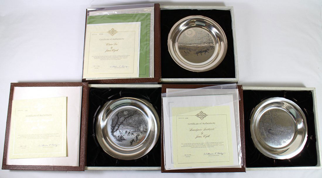 (3) STERLING FRANKLIN MINT JAMES WYETH PLATES: Three sterling silver James Wyeth Franklin Mint plates including Brandywine Battlefield, Winter Fox, and Skating on the Brandywine. Each with book style case.