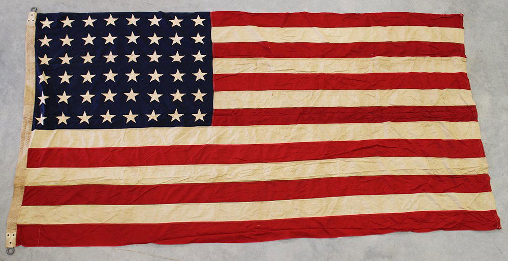 VINTAGE 48 STAR AMERICAN FLAG: Vintage hand stitched 48 star American flag. From the John Ybarbo collection. 8' 6" x 4' 3"