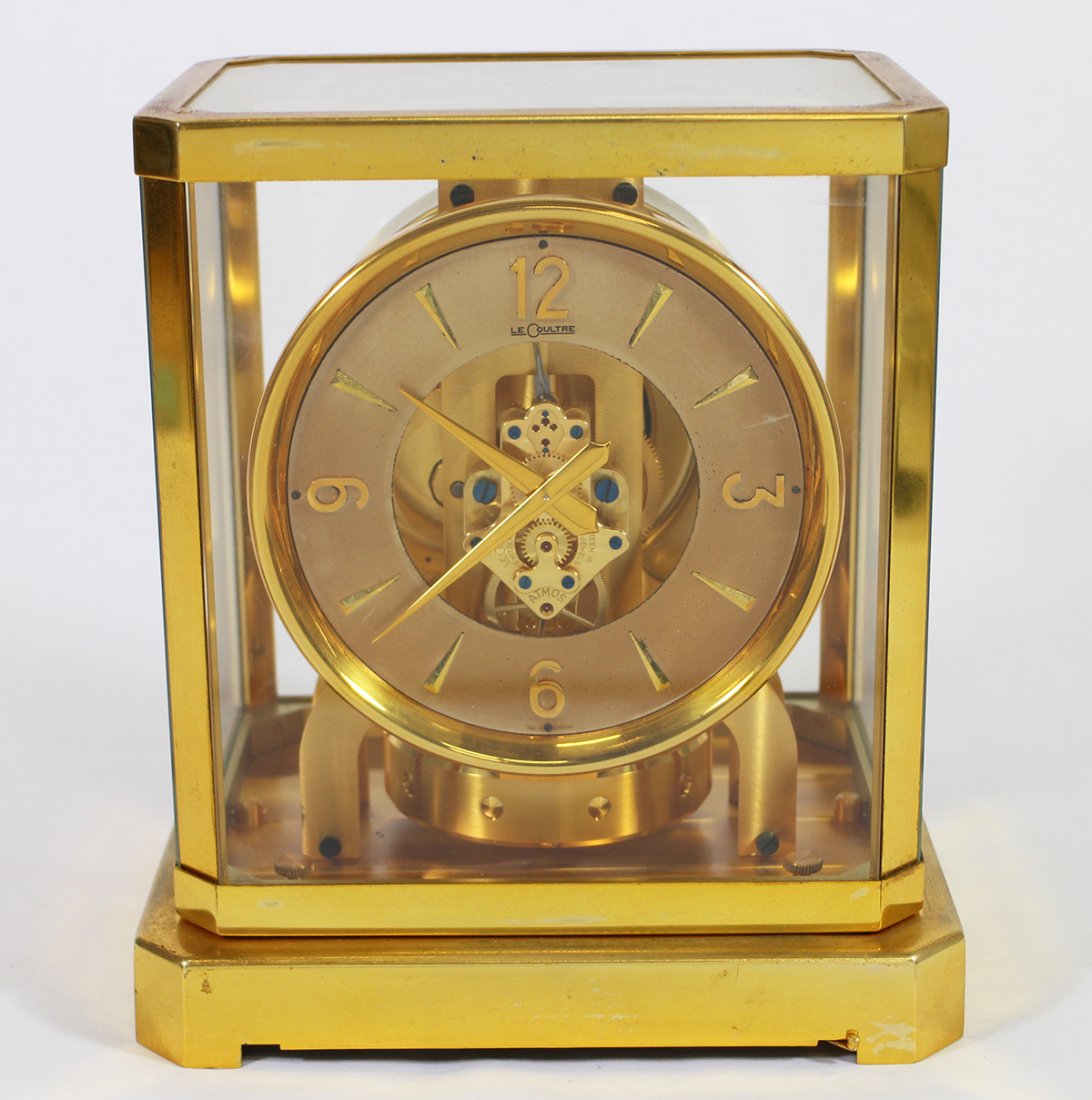 LECOULTRE ATMOS CLOCK: Le Coultre Atmos clock. Brass case with glass panels. 9 1/4" tall 7 3/8" x 5 1/2" wide.
