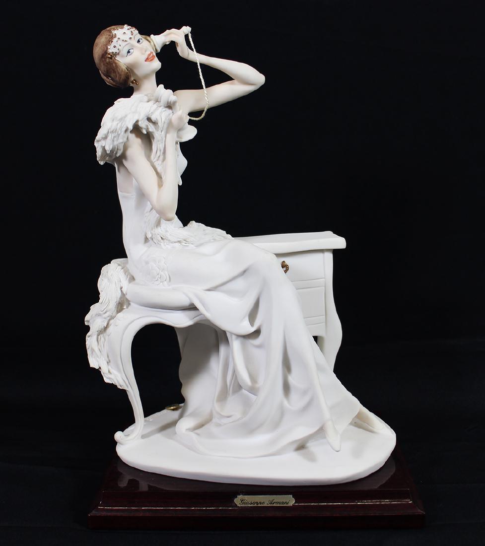 GIUSEPPE ARMANI WOMAN W/ TELEPHONE FIGURINE: Giuseppe Armani Art Deco style figurine of a woman on the telephone. 11" tall.