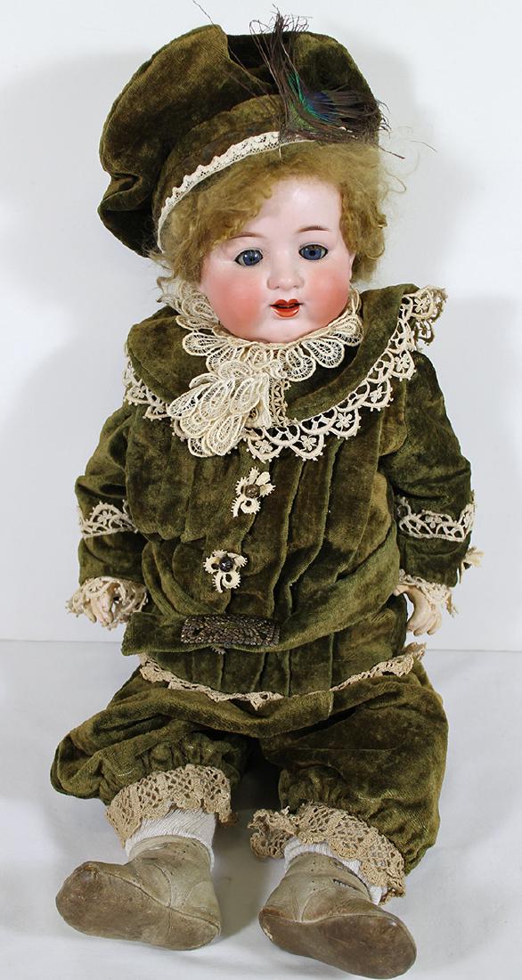 ARMAND MARSEILLE CHARACTER DOLL 992 A12M: German bisque head doll with composition body, blue sleepy eyes, open mouth with teeth. The back of her head is marked Armand Marseille Germany 992 A 12 M. She is 26" tall.