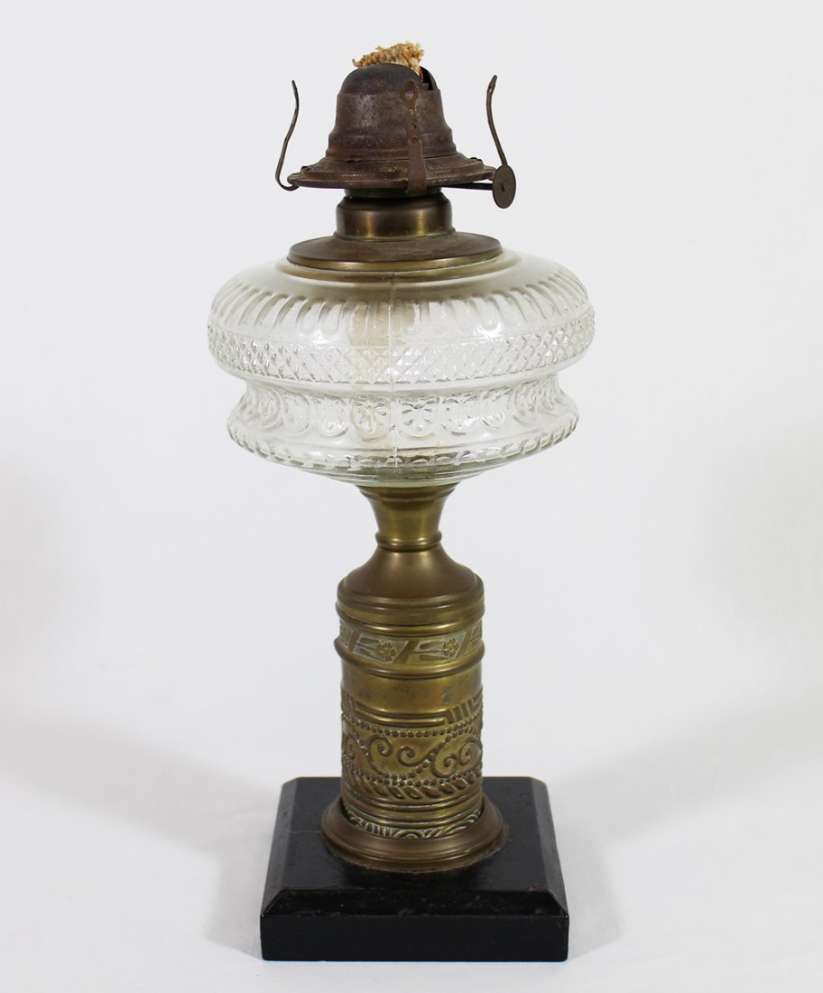 19TH CENTURY OIL LAMP: Glass floral & scroll motif oil lamp. 14" tall.