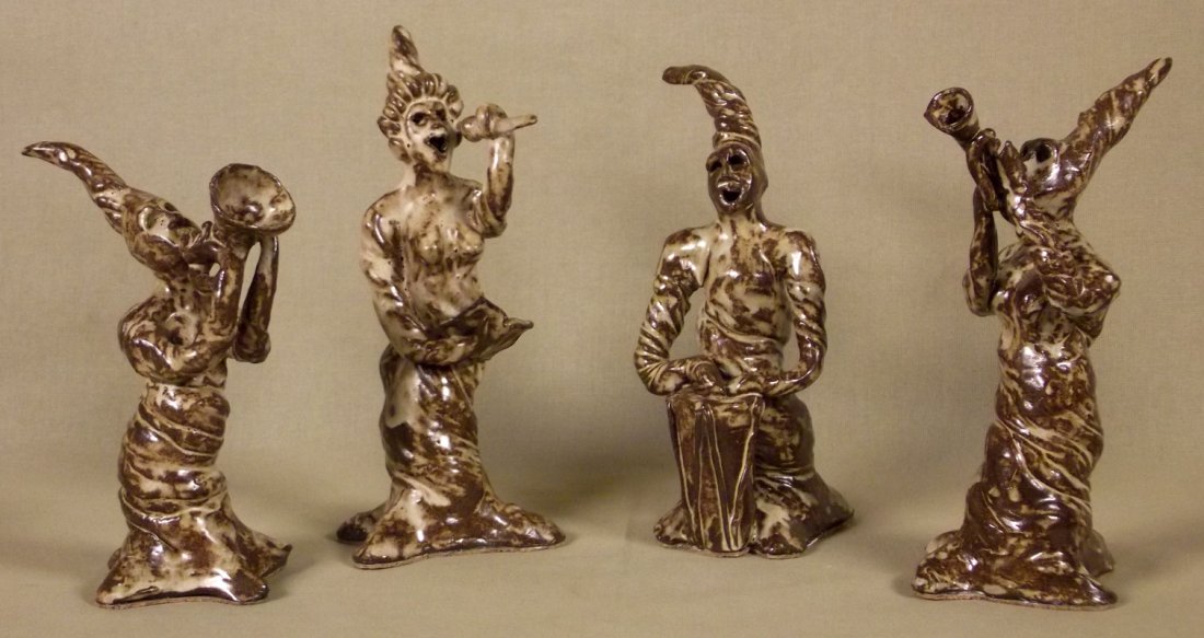 MATHERNE POTTERY: SWAMP PEOPLE. Set of 4 sculptures of musicians. Brown, tan. Signed. 9 x 5 in. each. Donated by Lisa Mills Matherne.