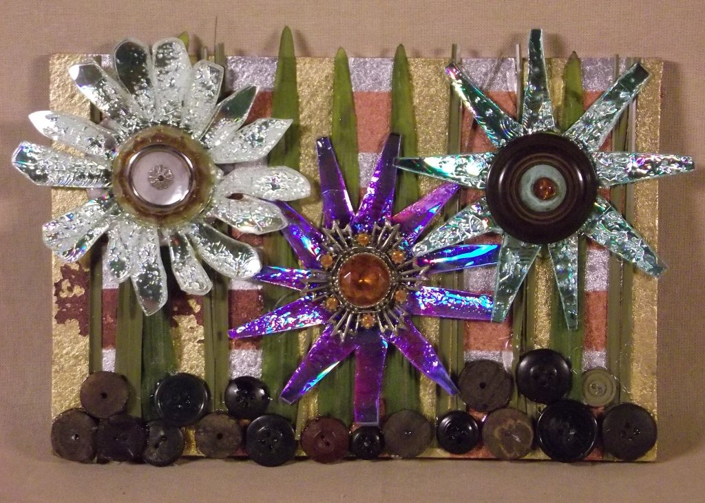 MATHERNE WALL HANGING: LISA MILLS MATHERNE. FLOWER BUTTONS. Mixed media wall hanging of flowers. Multicolored. 7 x 10 in. Donated by Lisa Mills Matherne. On-air Title: Matherne Wall Hanging. Estimated Value: $75 WYES Lot Nu