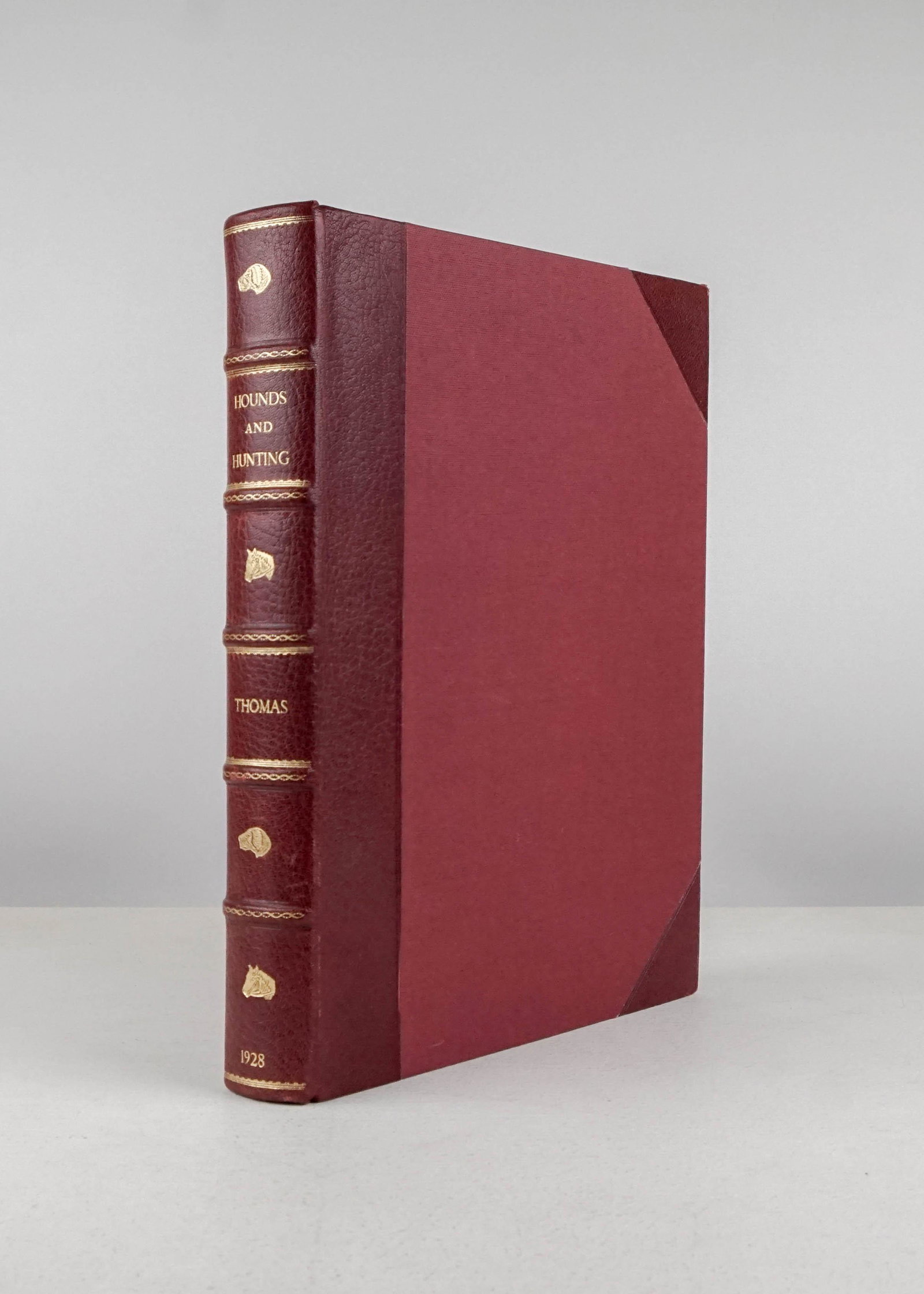 Thomas, Joseph B..Hounds & Hunting Through the Ages.: Thomas, Joseph B..Hounds & Hunting Through the Ages. Illustrated. 4to, 3/4 red morocco, spine gilt in 6 compartments with sporting ornaments, top-edge gilt; tips rubbed, scattered foxing, owner's insc