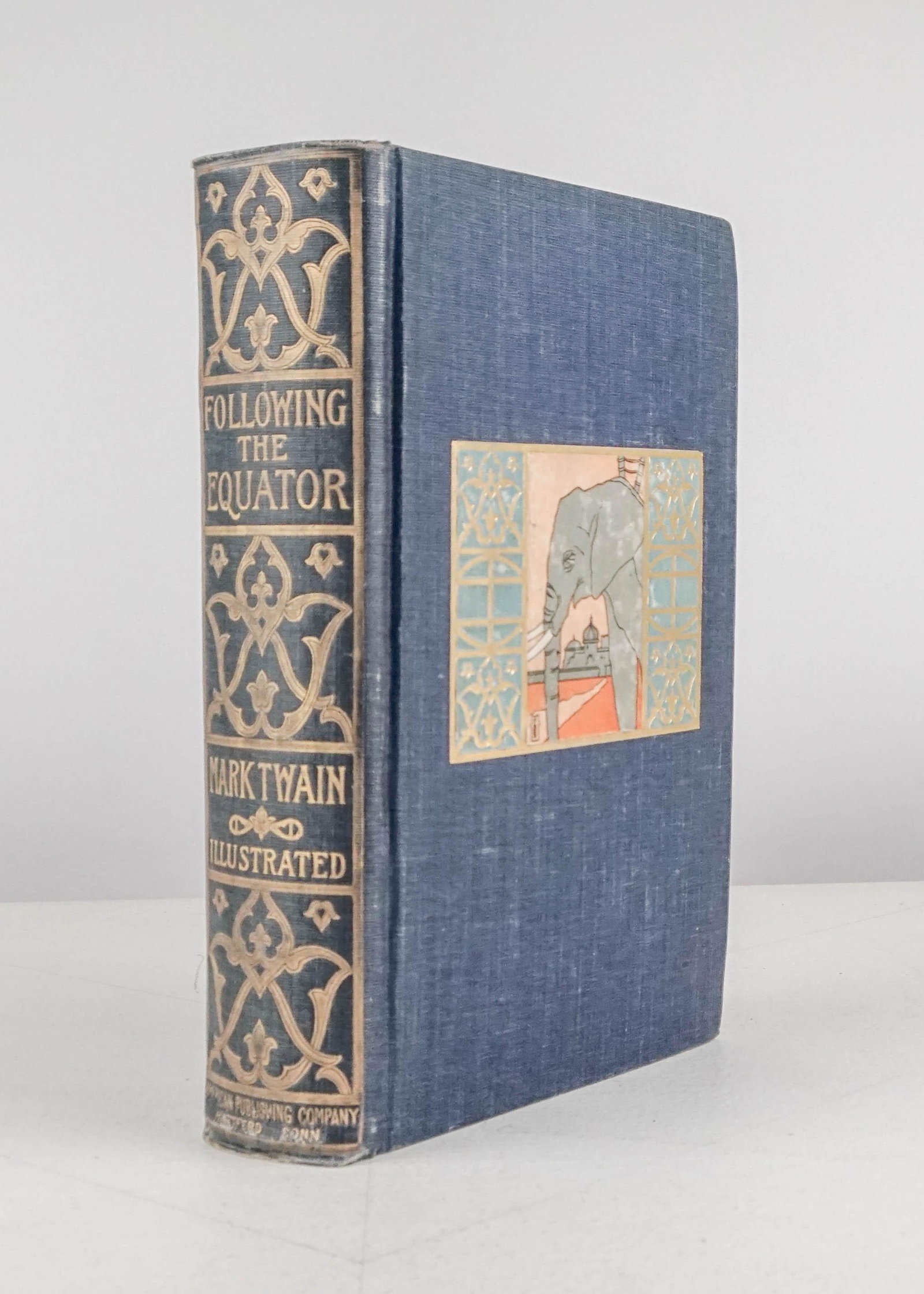 Twain, Mark: 181. Twain, Mark.Following the Equator. Illustrated. 8vo, pictorial cloth, housed in attractive morocco-backed case provided; moderate wear. FIRST EDITION. (BAL 3451).Hartford: American Publishing,, 1