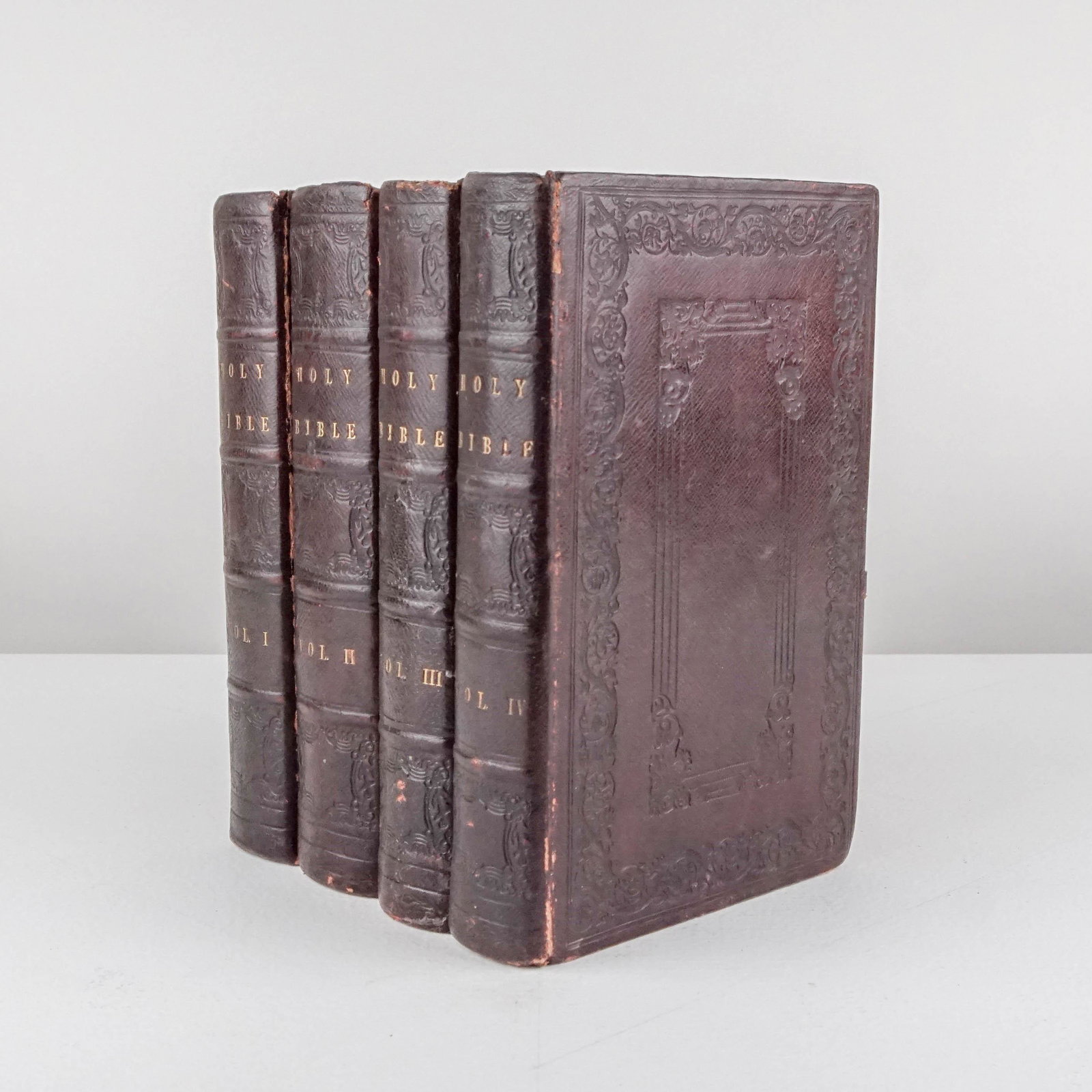 American Binding: 9. American Binding.The Holy Bible. 4 volumes. 8vo, full maroon morocco, covers with vine & floral boarders around central blind panels repeated in 5 compartments on spines, all edges gilt; joints fla