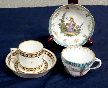 Porcelain: Two fine porcelain cups & saucers. Each about 2 inches high; light wear to gilt on rims. Early Royal Vienna with gilt and brown repeating patter. Blue underglaze bindenschild, impressed #39. (early 19