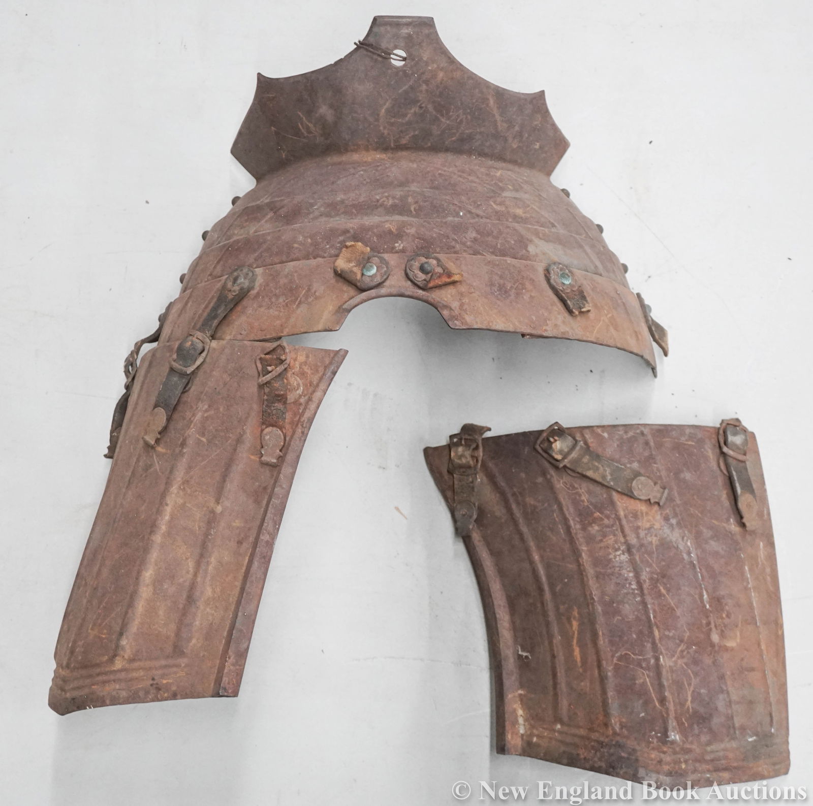 Armour: 32. Armour. Collection of 7 iron plate or multiple iron lame parts of a suit of armour. Various sizes, remnants of leather straps; rusted. Europe?, 19th-century [800/1200]