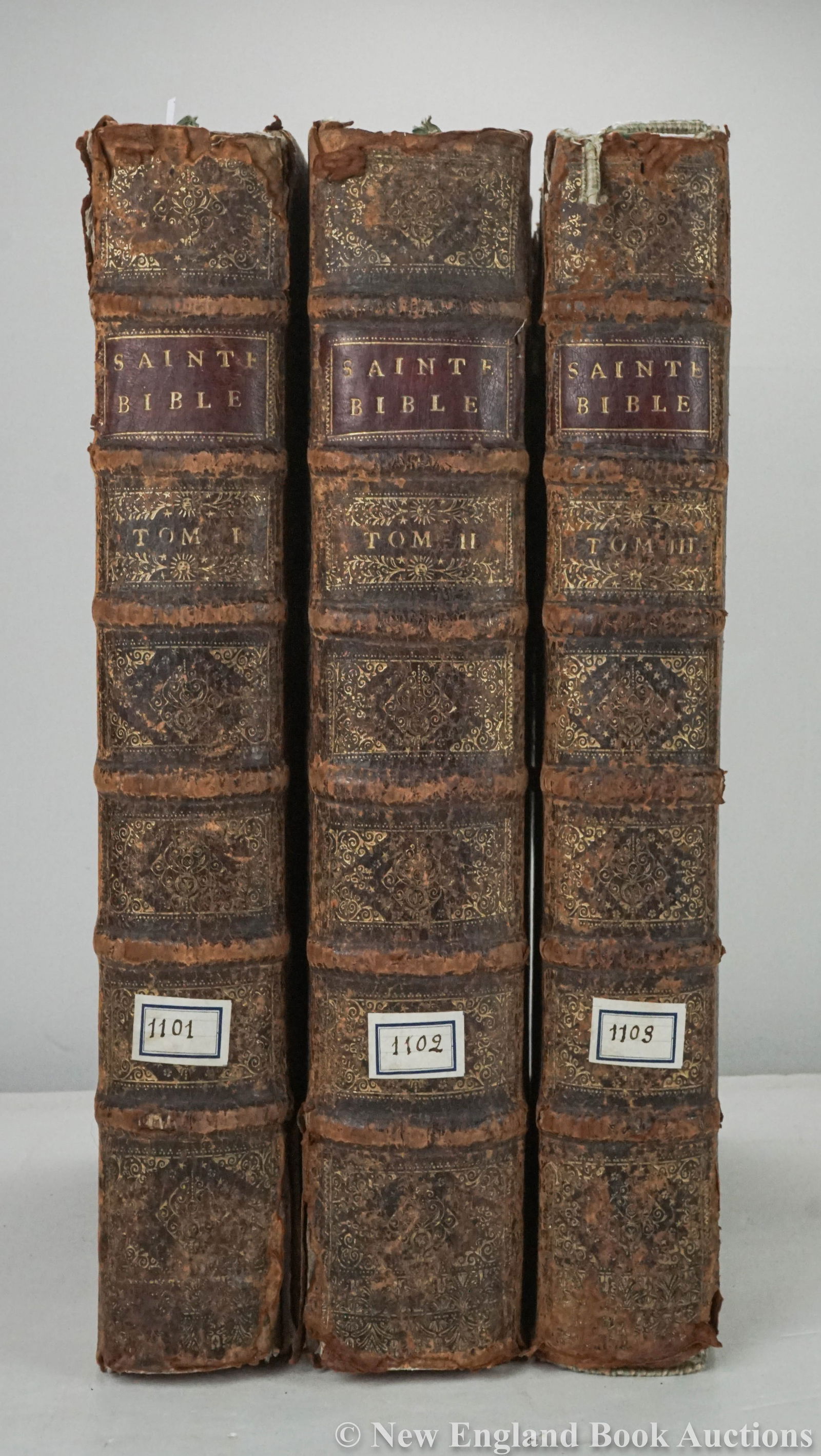 Bible: 33. Bible. La Sainte Bible. Text in Latin and French. Engravings, including head-pieces by Desmarestz. Volumes 1-3 (of 4). Folio, old calf ruled in blind, spines gilt in 7 compartments; spine-ends