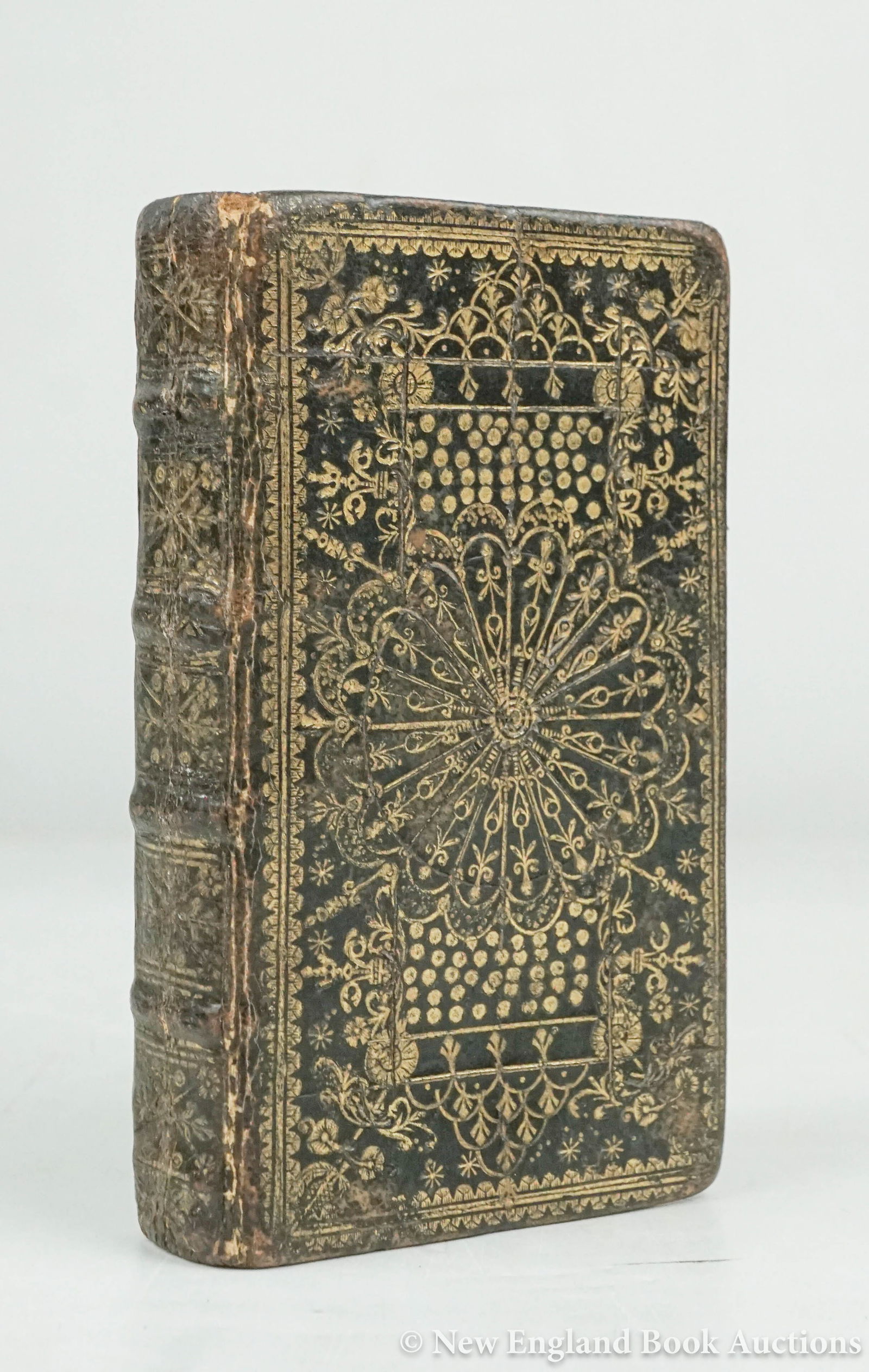 Binding: 37. Binding. The Holy Bible. 24mo, contemporary morocco with gilt wheel patterned covers, spine gilt in 5 compartments, all edges gilt, remnants of decorated endpapers; lacking title and part of the O