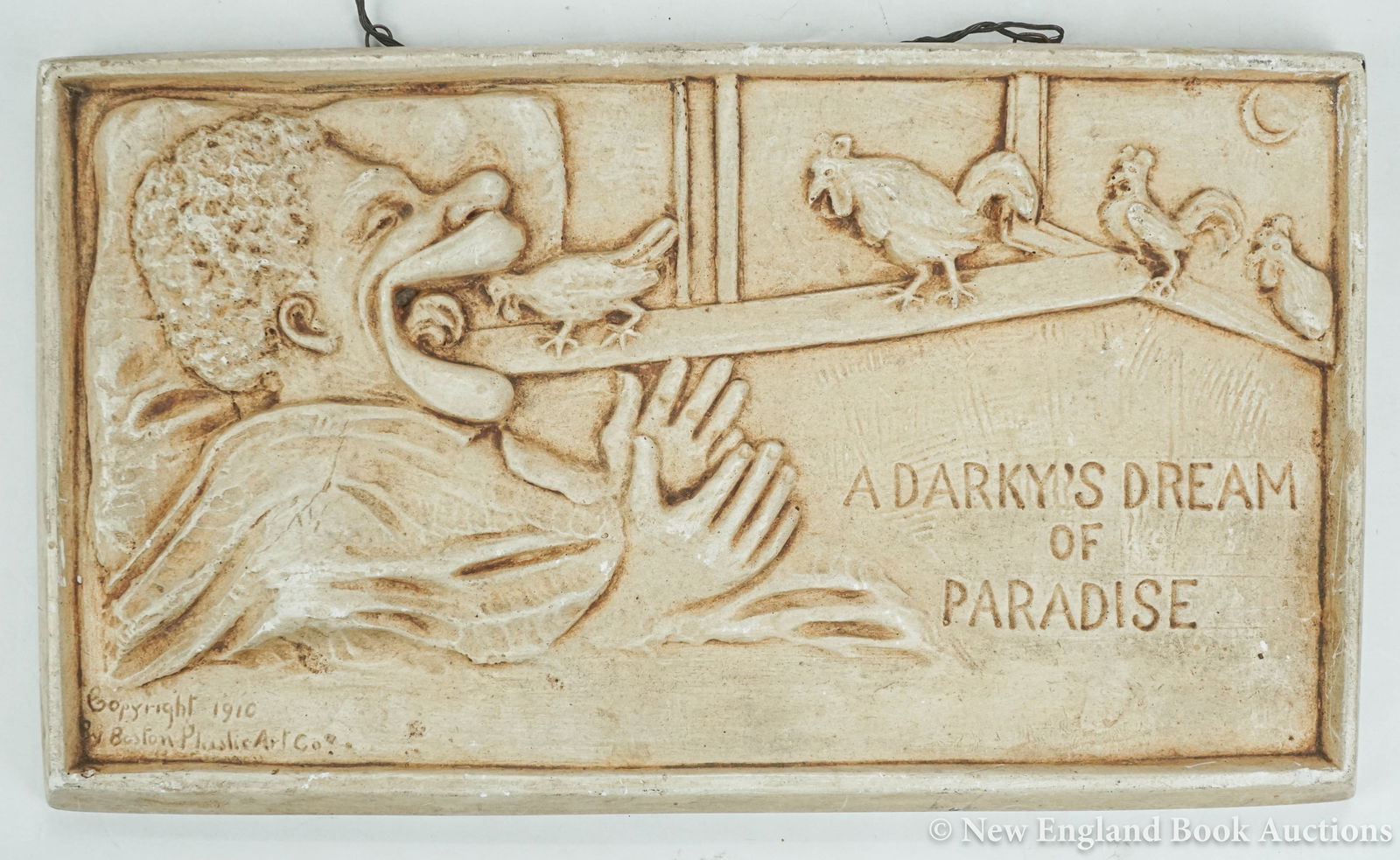 Wall Plaque: 32. Wall Plaque. "A Darky's Dream of Paradise." Embossed composite plaque. 7 x 12 inches; moderate wear. Boston Plastic Art Co., 1910 [75/100]