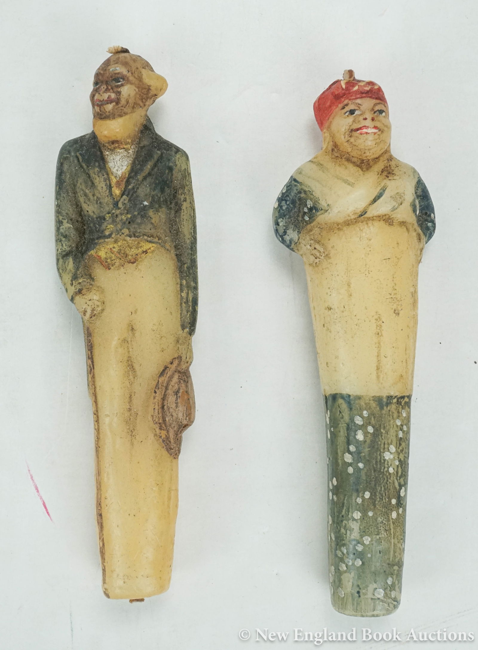 Folk Art: 38. Folk Art. Pair of 6 inch wax candles carved to depict a black woman and man, painted; some wear and soiling. American, Late 19th-century? [75/100]
