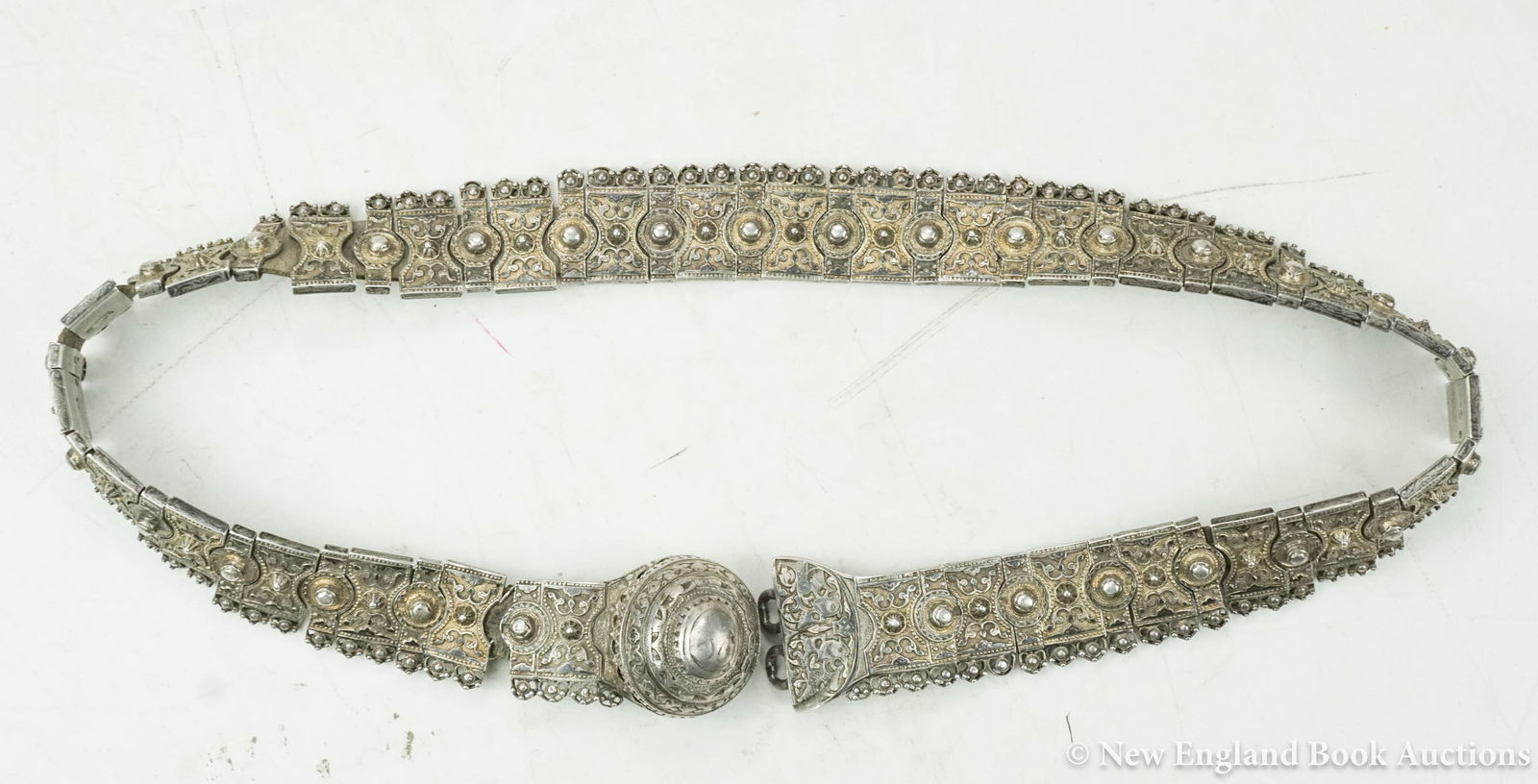 Russian Silver: 122. Russian Silver. Silver Russian Belt. 55 interlocking gilt silver links with large silver clasp. 19.7 ounces (17.95 troy). 33 inches; some wear. Russia, 19th-century [4000/6000] Aleksandr