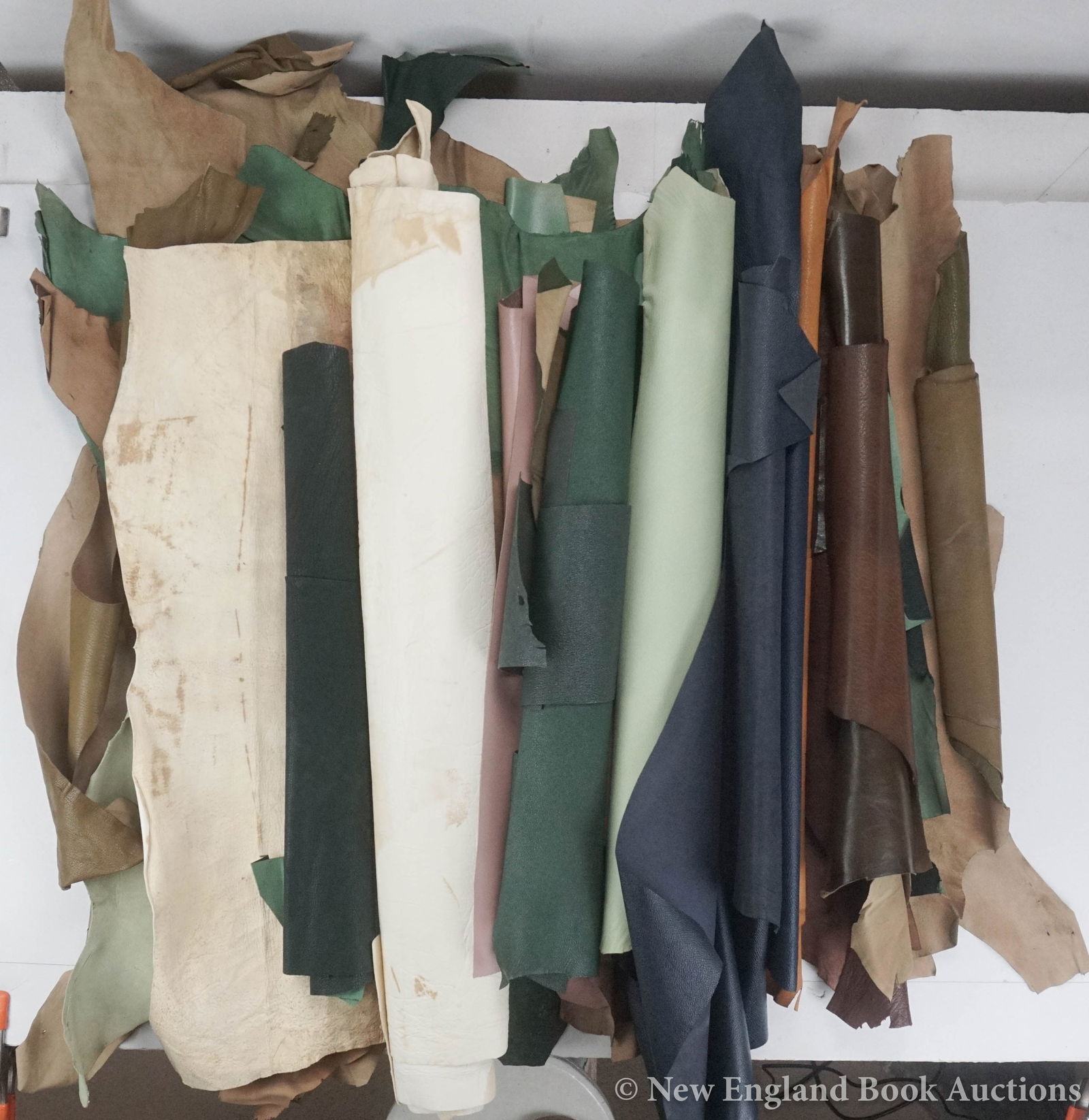 Bookbinding Leather: 209. Bookbinding Leather. Group of about 19 skins + several pieces. Mostly Various colors and sizes; light wear, some clipped. Np, nd [200/300]
