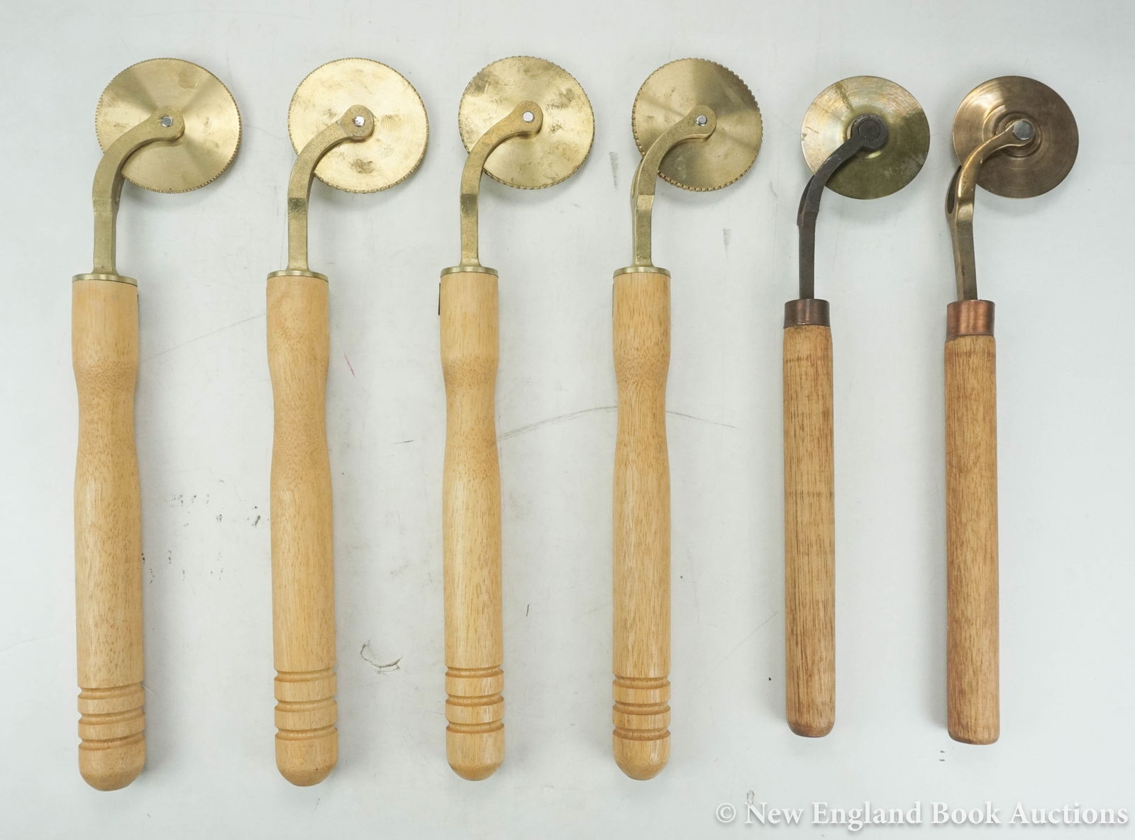 Bookbinding: 211. Bookbinding. Group of 22 finishing tools for gilt decorating leather. Britain and others, 20th-century [500/700] Includes: 6 rolls (2 single rule, 4 patterned) * 4 pallets (1 single rule,