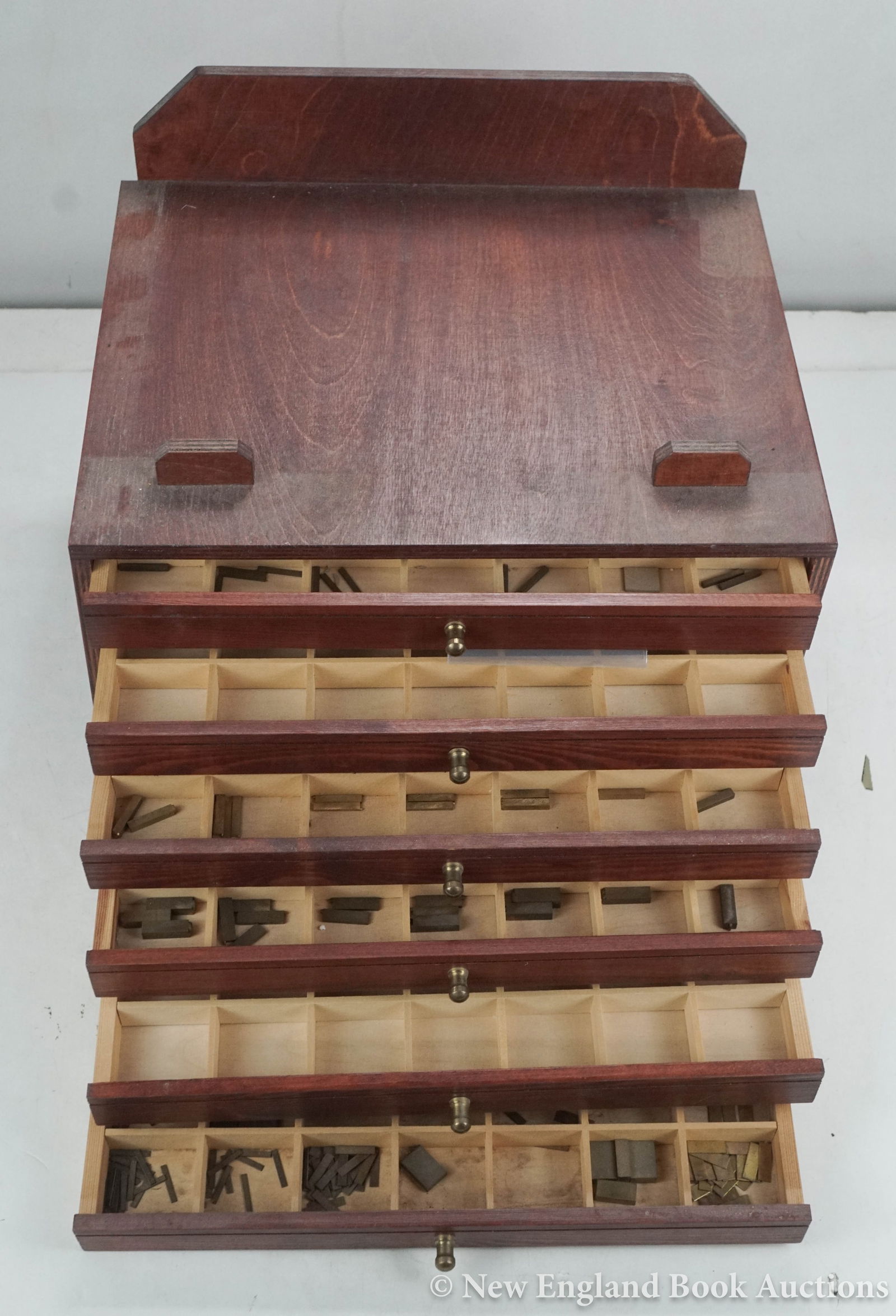 Printing: 224. Printing. Hot press type clamp with 11 composing sticks. With over 200 brass alloy type ranging between 8 and 24 pts. Np, nd [250/350] Together with over 100 brass or lead alloy type of