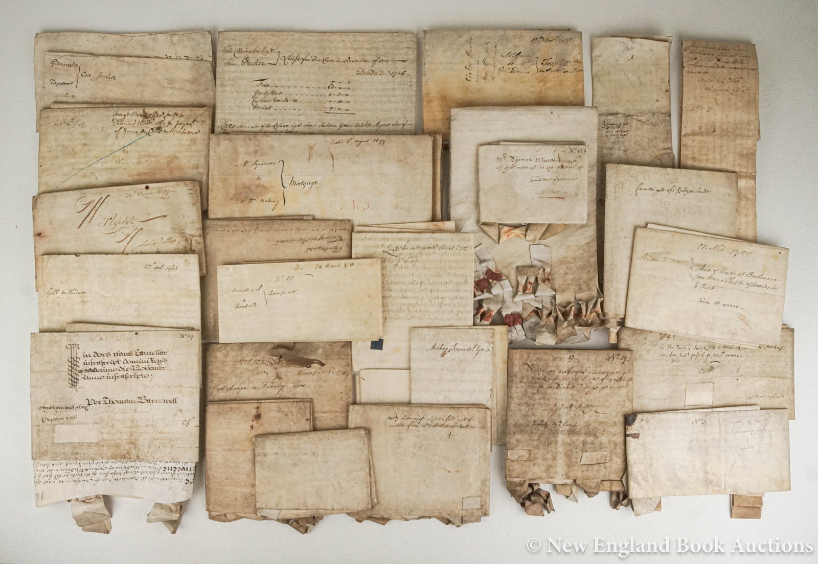 Manuscripts: 115a. Manuscripts. Group of 26 English documents, mostly indentures, but also leases, agreements, and mortgages. Decorative headings (a few engraved or woodcut). Parchment, varying sizes; moderate
