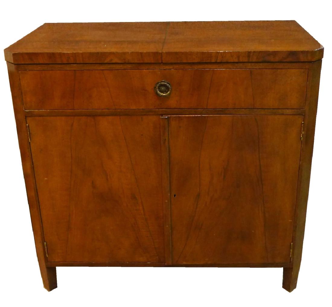 Mid Century Flip-Top Bar Cabinet: Modern bar cabinet with top drawer and two cabinet doors open to reveal shelving. Imperfections. Height: 34 1/2", Length: 36 1/2", Width: 19" (modern, furniture, storage) STERLING ASSOCIATES STRIVES T