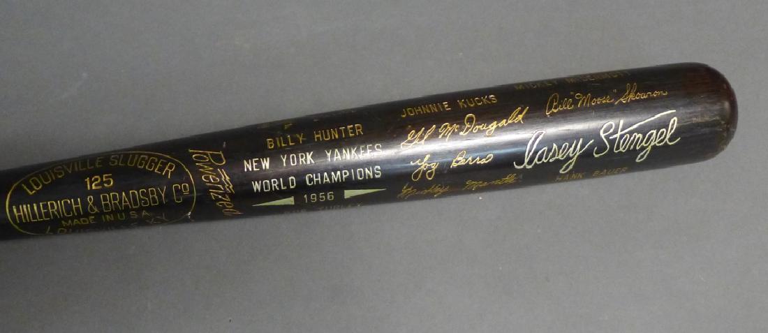 1956 NY Yankees Hillerich & Bradsby WS 'Black' Bat: From the collection of Hall of Fame Sports Writer, Bill Madden. Striking black and gold engraved bat commemorating the 1956 New York Yankees. Hillerich & Bradsby produced this special limited edition 