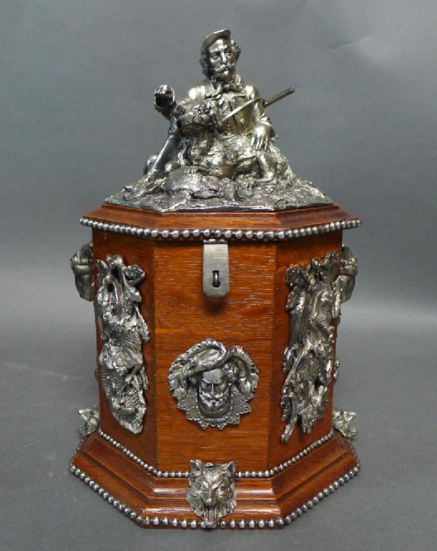 Black Forest Humidor w/ Silvered Accents: Antique oak humidor with silver over bronze sculptural mounts with hunting theme. Octagon shape and hinged lid. No noticeable maker's marks. Height: 11", Width: 8" (decorative accessory, box, hunter, 