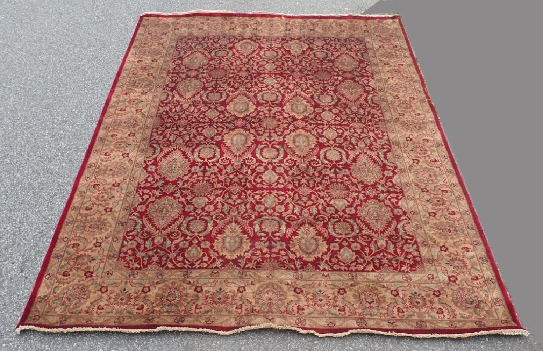 Vintage Persian Rug: Stunning stylized floral patterns on red background. Tan background on Border . No makers label. Length: 126"; Width: 97". Imperfections, stains. Some noticeable wear. (area carpet, textile, interior 