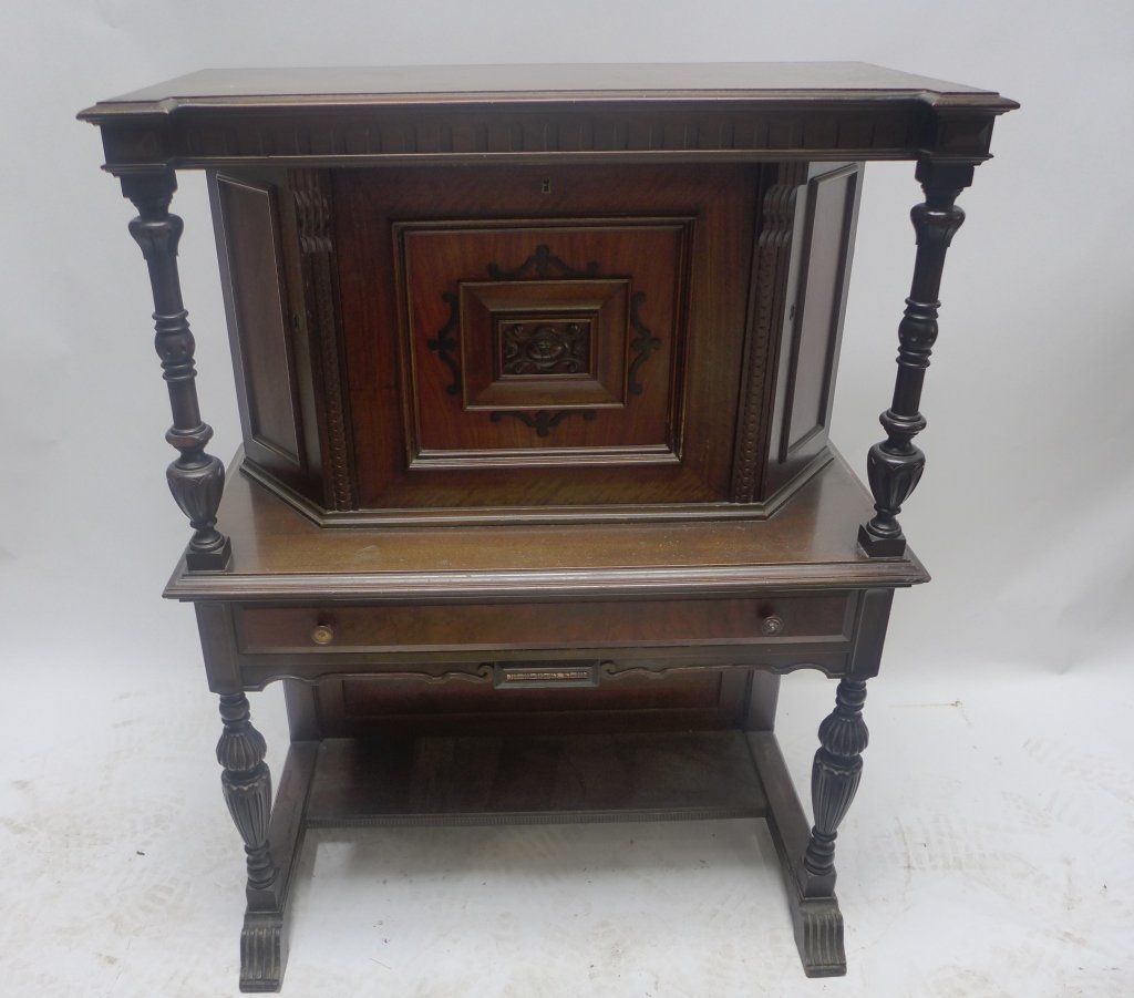 Mahogany Secretary Desk: Secretary with spindle detail.Height: 48" Width: 35" Depth: 19"Imperfections: Wood chipping on inside.(Mahogany,living room,dresser,set,antique,brown)STERLING ASSOCIATES STRIVES TO PROVIDE ACCURATE, O
