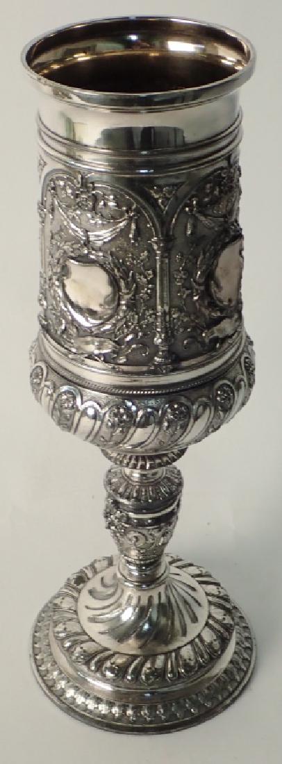 Large Silver Plated Trophy Chalice: Impressive stemmed chalice/ wine goblet with Repousse pattern. Engraving along top reads in part: "Willaura Racing Club Cup...1933" Height: 14" Width: 5" Depth: 5" Approximate weight: 1656 grams. STER
