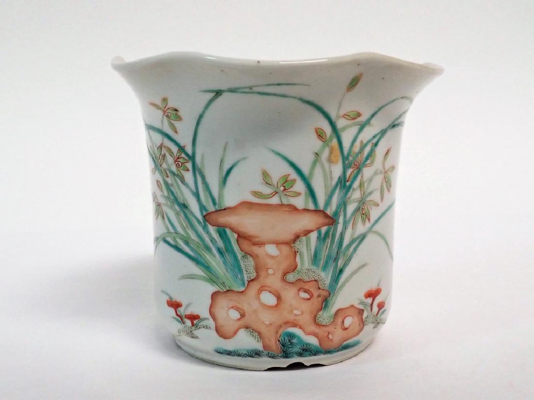 Antique Chinese Famille Rose Planter: Chinese pocelain planter with scalloped top. Hand painted with floral and possible ginger root design. Age, wear. No noticible makers mark. Height: 4 3/4"; Width: 5 3/8"; Depth: 5 3/8". (19th Century,