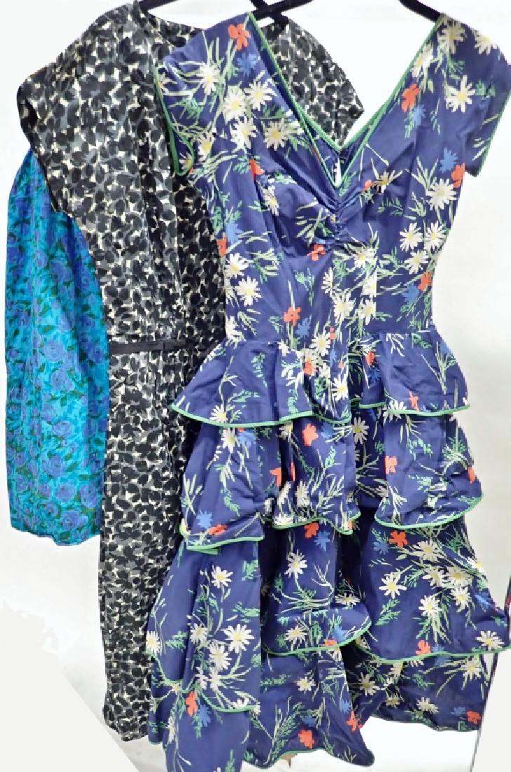 Vintage Designer Floral Dress Assortment: Collection of 3 floral design dresses. Designer labels includes: Ruth Dillon, Nettie Rosenstein and Margaret Newman. Various colors and styles. Imperfections. STERLING ASSOCIATES STRIVES TO PROVIDE AC