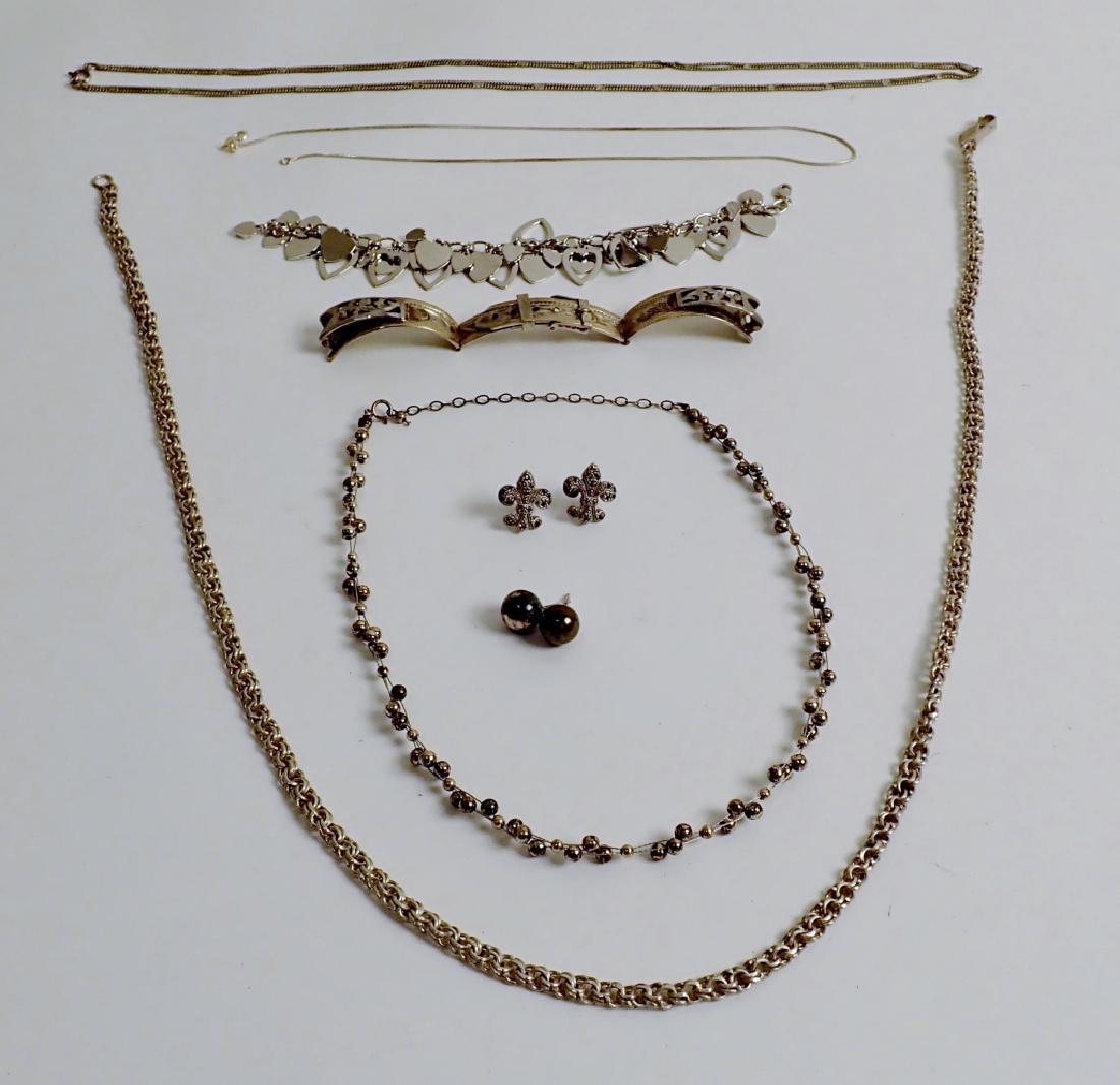 Sterling Silver jewelry Assortment: From the Estate of Joyce Dankoff. 10 pieces of sterling include two pairs of earrings, necklaces, bracelet and more. Most marked 925 or sterling. Imperfections. Total approximate weight: 118 grams. He