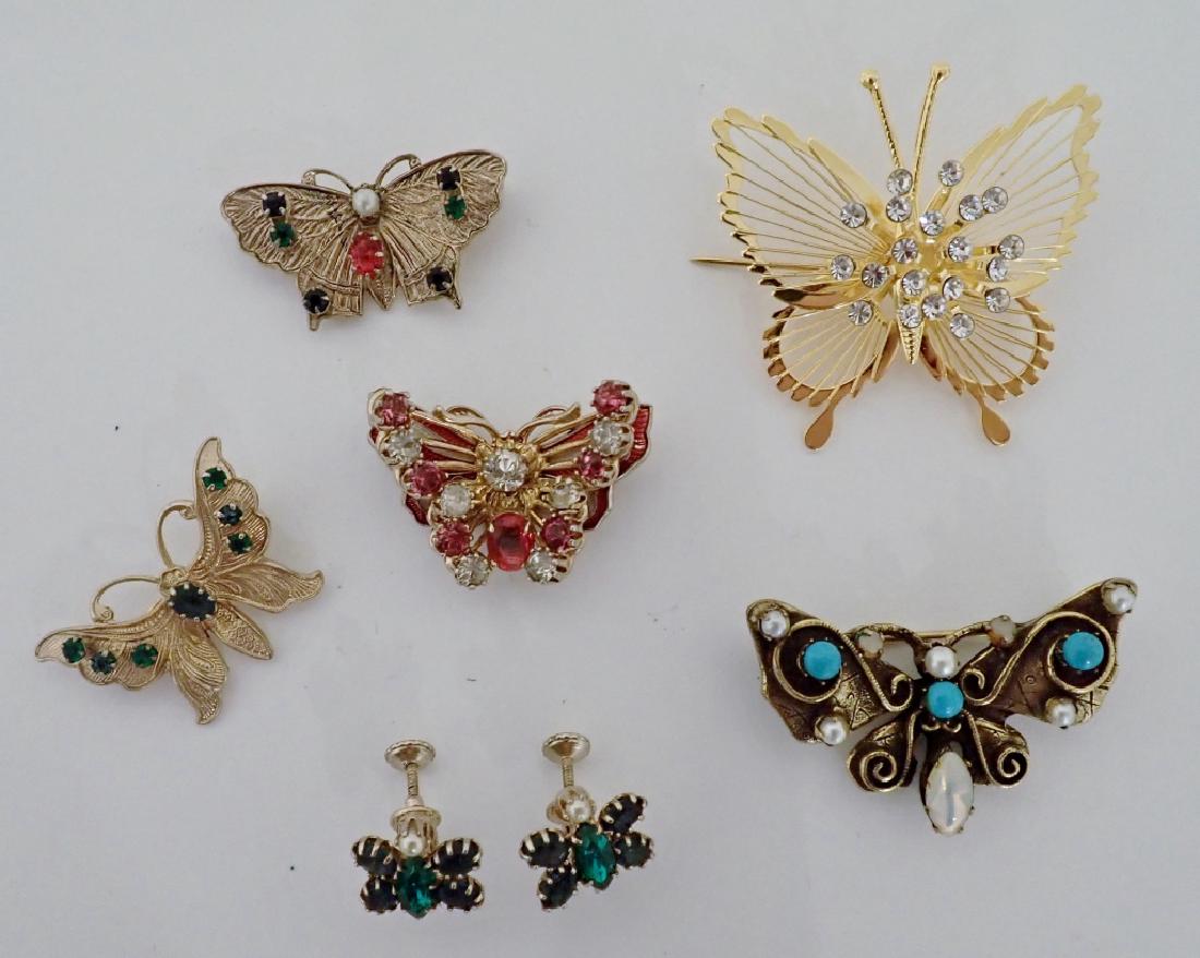 Vintage Butterfly Jewelry Collection: 7 pieces of butterfly inspired fashion jewelry include: Pair of green stone screw-back earrings and 5 pins with various stones & crystals. Makers marks include: Accessocraft NYC, original by Robert. H