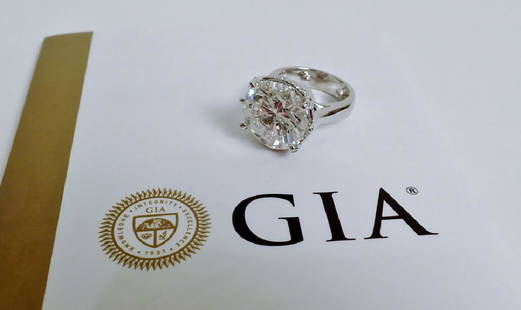 Stunning GIA-Certified 11.17 Carat Diamond Ring: From the Estate of Joyce Dankoff. Large GIA Certified solitaire diamond ring. 11.17 Diamond with GIA report, 4 prong 14k white gold band w/ diamond accent. Stunning Diamond ring is set in 14K white go