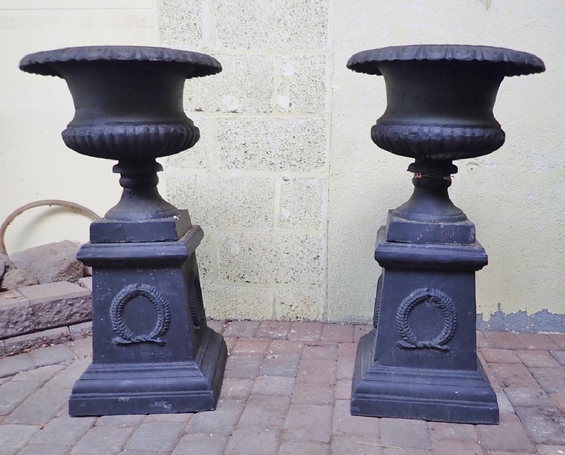 Pair Black Painted Cast Iron Urns on Pedestals (1 of 6)