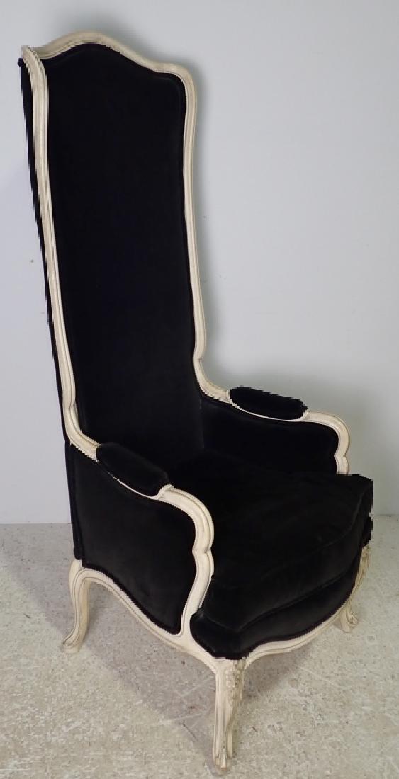 Black Upholstered High Back Arm Chair: High back wood upholstered arm chair. Carved floral design to front legs. Some imperfections. Height: 54 1/2", Width: 23 1/4", Depth: 19" . Seat height with cushion: 17 1/2".(furniture, seating, seat,