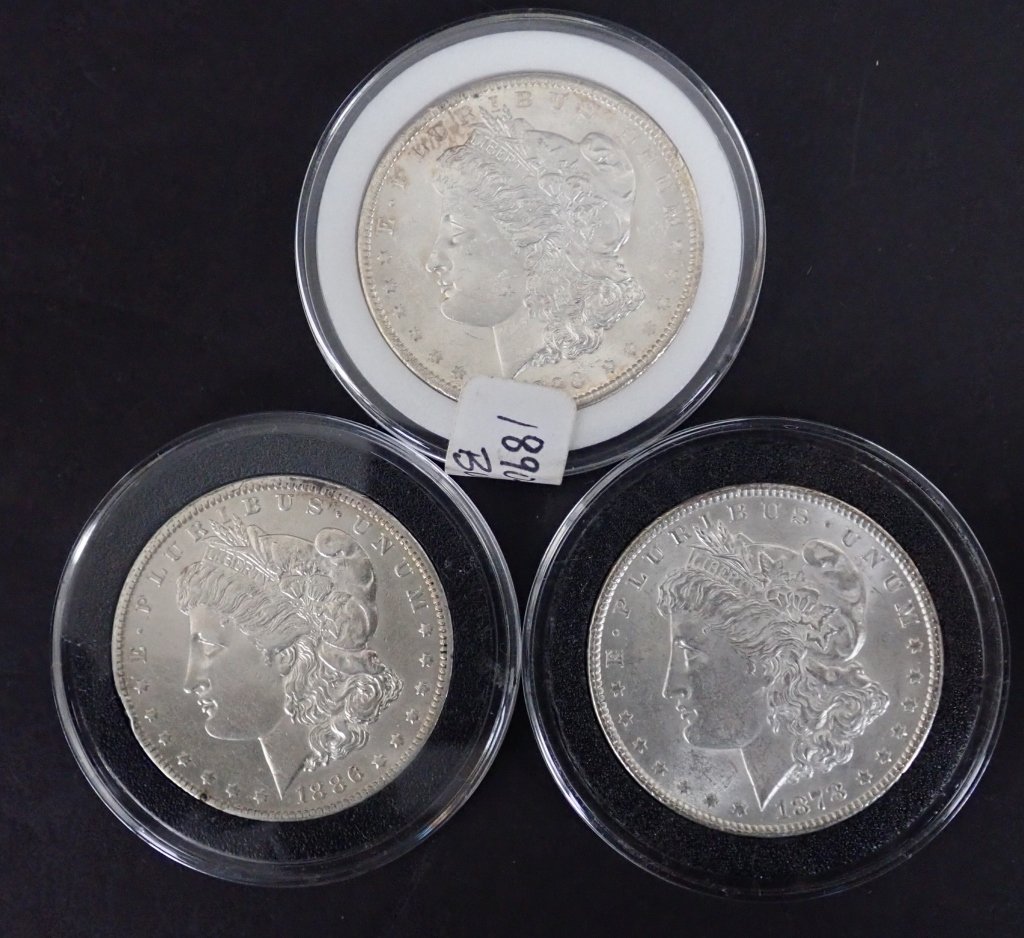 Three Morgan Silver Dollars 1878, 1886 O & 1890 O: Three Morgan silver dollar coins. Includes cased: 1878, 1886O & 1890O.($1, money, collecting, Numismatics, currency, eagle, E Pluribus Unum)STERLING ASSOCIATES STRIVES TO PROVIDE ACCURATE, OBJECTIVE,