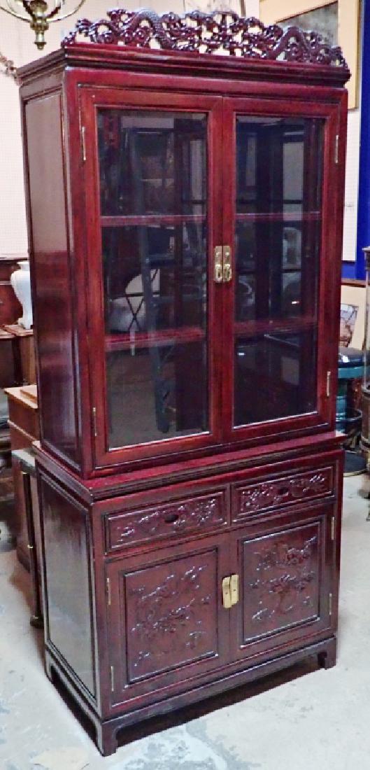Carved Chinese Redwood Curio Display Case: Double glass doors show shelving, two doors & two drawers of carved wood with dragon designs. Features folding top piece with cut out, double dragon design, brass hardware and lighting (untested). Hei