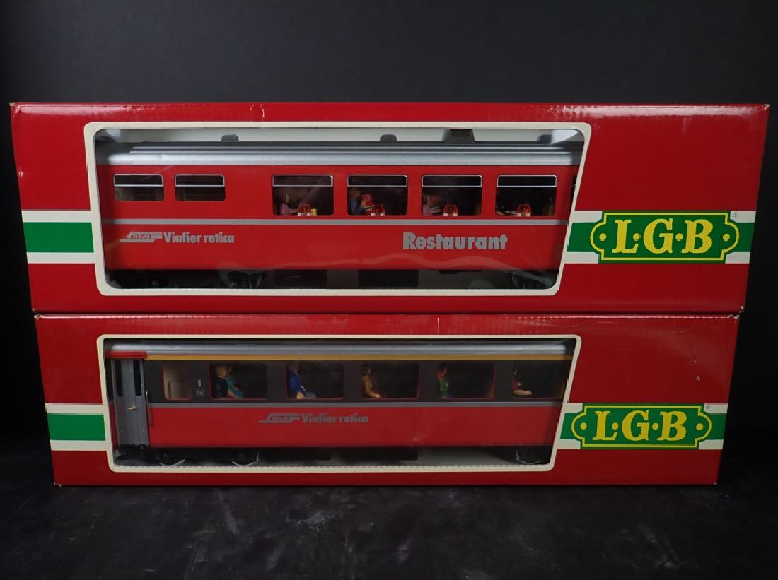 LGB Ratische Bahn Restaurant and Passenger Car: Lot includes: Two LGB (Lehmann Gross Bahn) Model Train Cars, Ratische Bahn Viafier retica Series, Model Numbers: 3067 and 3068, made in W. Germany (West Germany). Both come in original packaging / box
