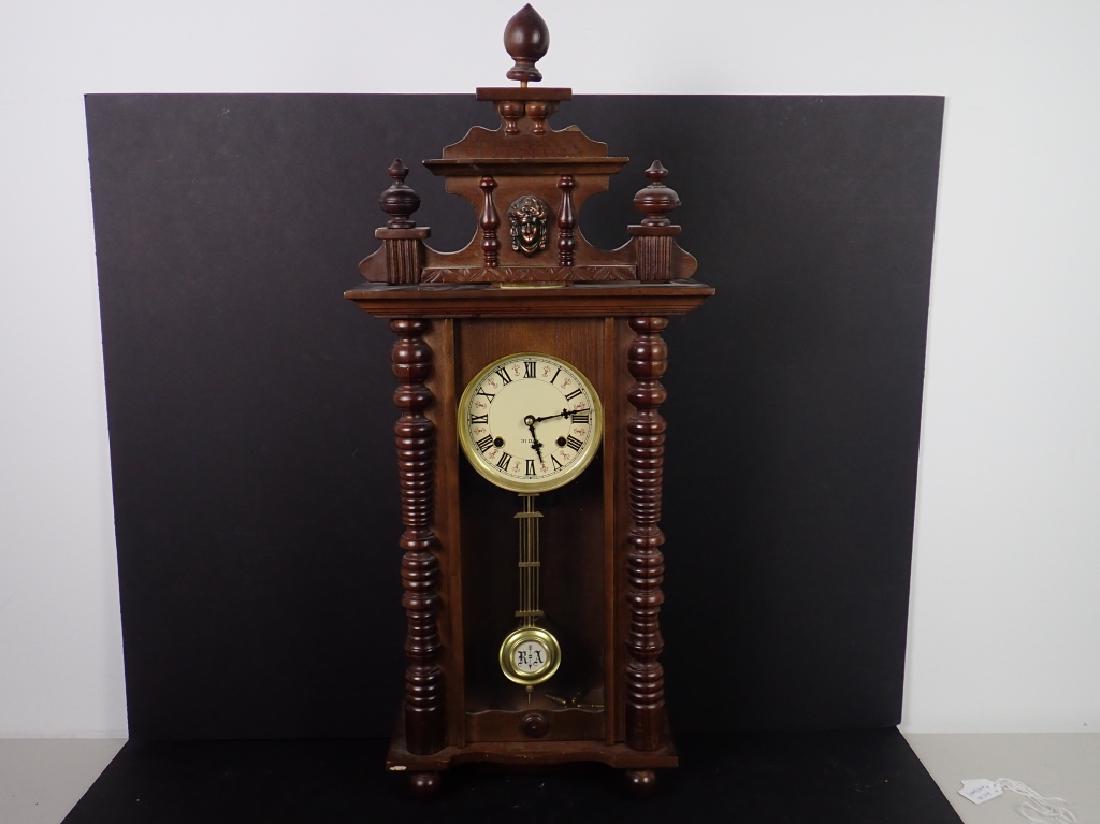 Vintage Wooden RA 31 Day Pendulum Clock: Vintage R A Pendulum 31 Day wooden wall clock with finials and half-columns, removable top pediment, wooden frame door with glass pane, made in Korea. Imperfections: age, UNTESTED, possible missing pi