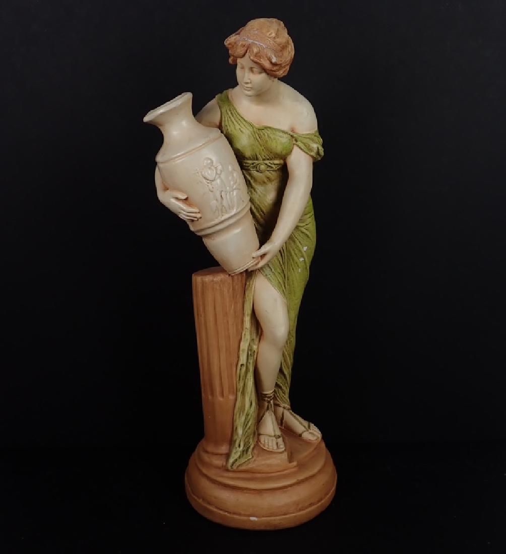 Plaster Sculpture, Woman of Antiquity with Vase: Plaster Sculpture of Hellenic woman in green chiton holding vase with Grecian Doric column, no maker's mark found. Imperfections: age, chipping, scratch(es), wear. Dimensions: Height: 28 7/8"; Width:
