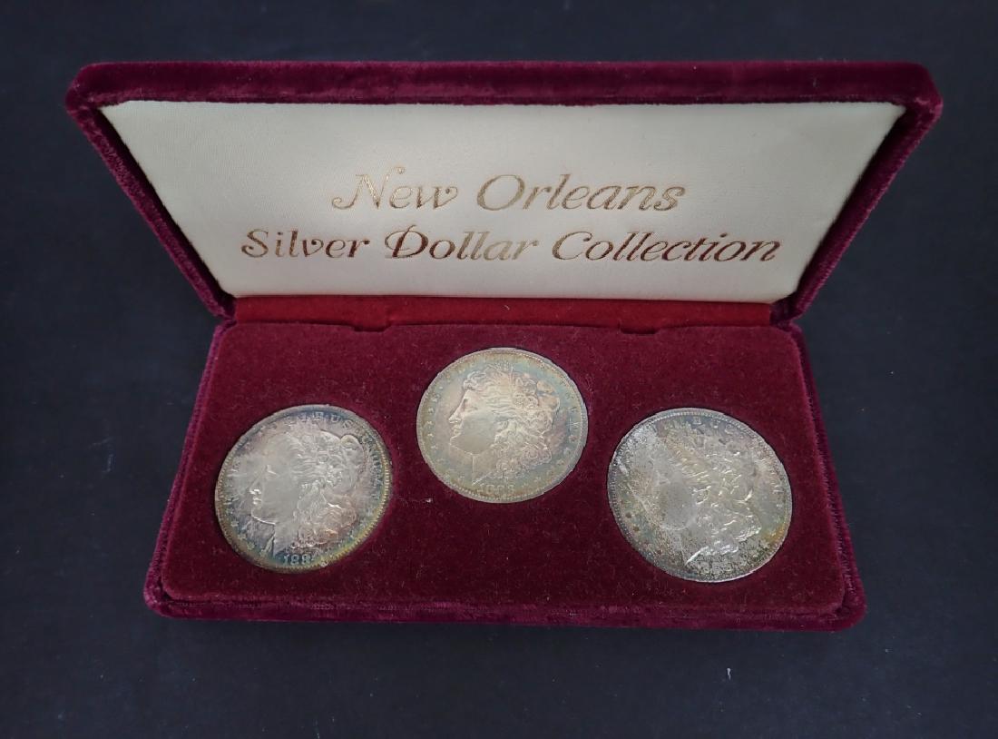 Silver Morgan Dollar $1 San Francisco Set, 3 Coins: Set of three Silver Morgan One Dollar coins. Features one each: 1880 1881 1882 In case (National, USA, money, collecting, Numismatics, currency) STERLING ASSOCIATES STRIVES TO PROVIDE ACCURATE, OBJECT