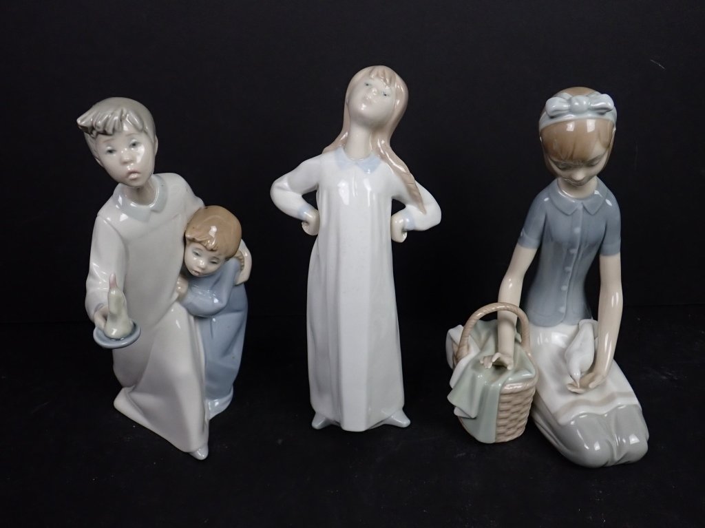 3 Assorted Lladro Porcelain Child Figurines: Lot includes: Three (3) Lladro Porcelain Children Statues: one (1) boy and girl with candle figurine, marked on underside; one (1) girl in gown leaning back figure, marked on underside; one (1) girl w