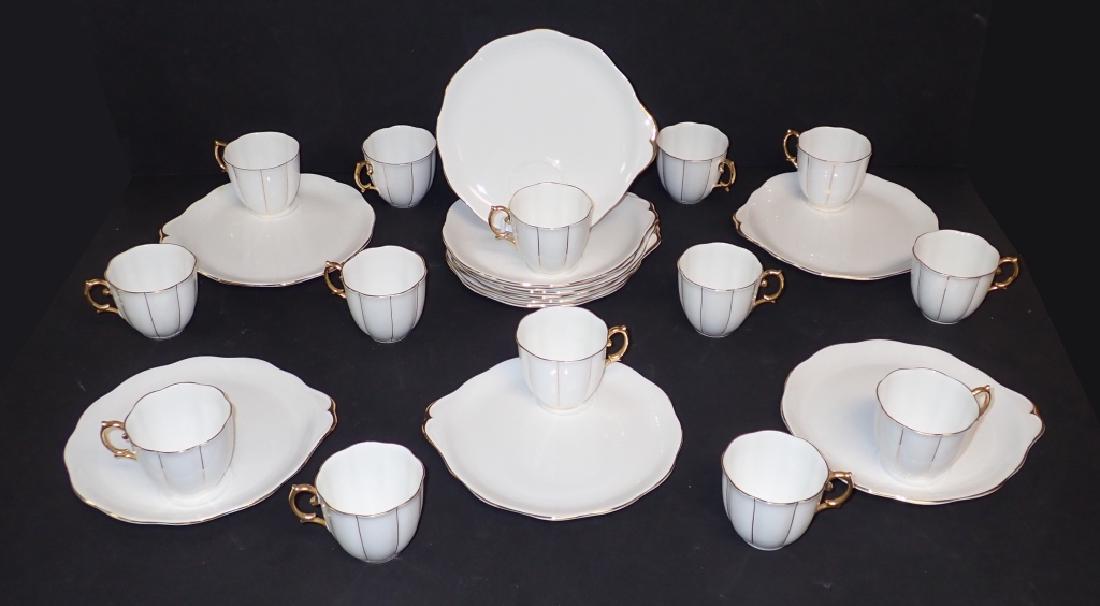 Royal Albert Fine China Snack Plates & Cups: Set of 12 Royal Albert "Kent" snack plates & Tea Cups. Description: Scalloped, Embossed, Gold Lines, Verge&Trim Pattern: Kent by Royal Albert Tea cup height: 2 7/8". Plate: Width: 9"; Depth: 8 1/4". S