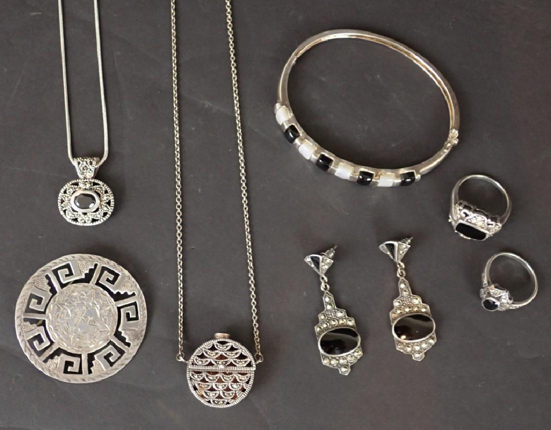 Silver, Marcasite & Onyx Jewelry Assortment: Silver and silver-tone jewelry assortment includes rings, earrings, necklaces, bangle bracelet and pin. Pin diameter: 1 3/4". Coin purse with chain total length: 14 1/2". STERLING ASSOCIATES STRIVES T