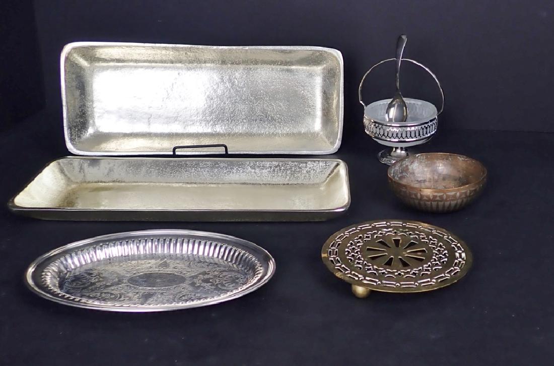 Collection of Table Ware: Six assorted pieces of serving ware in various metals. Includes: - Two possible aluminum rectangular serving trays. No makers marks. Height: 1"; Width: 14 5/8"; Depth: 5 3/4". - Oval silver plate plat