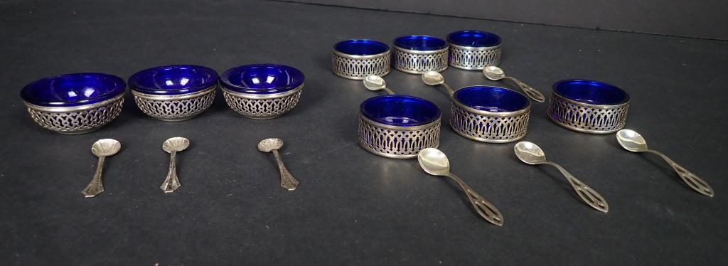 Silver & Cobalt Glass Salt Cellars with Spoons: Grouping of Sterling Silver Salt Cellars with Cobalt Blue Glass Inserts. 3 dome and 6 flat bottom each accompanied by a small salt spoon also in sterling silver. Dome shaped inserts are fully removabl